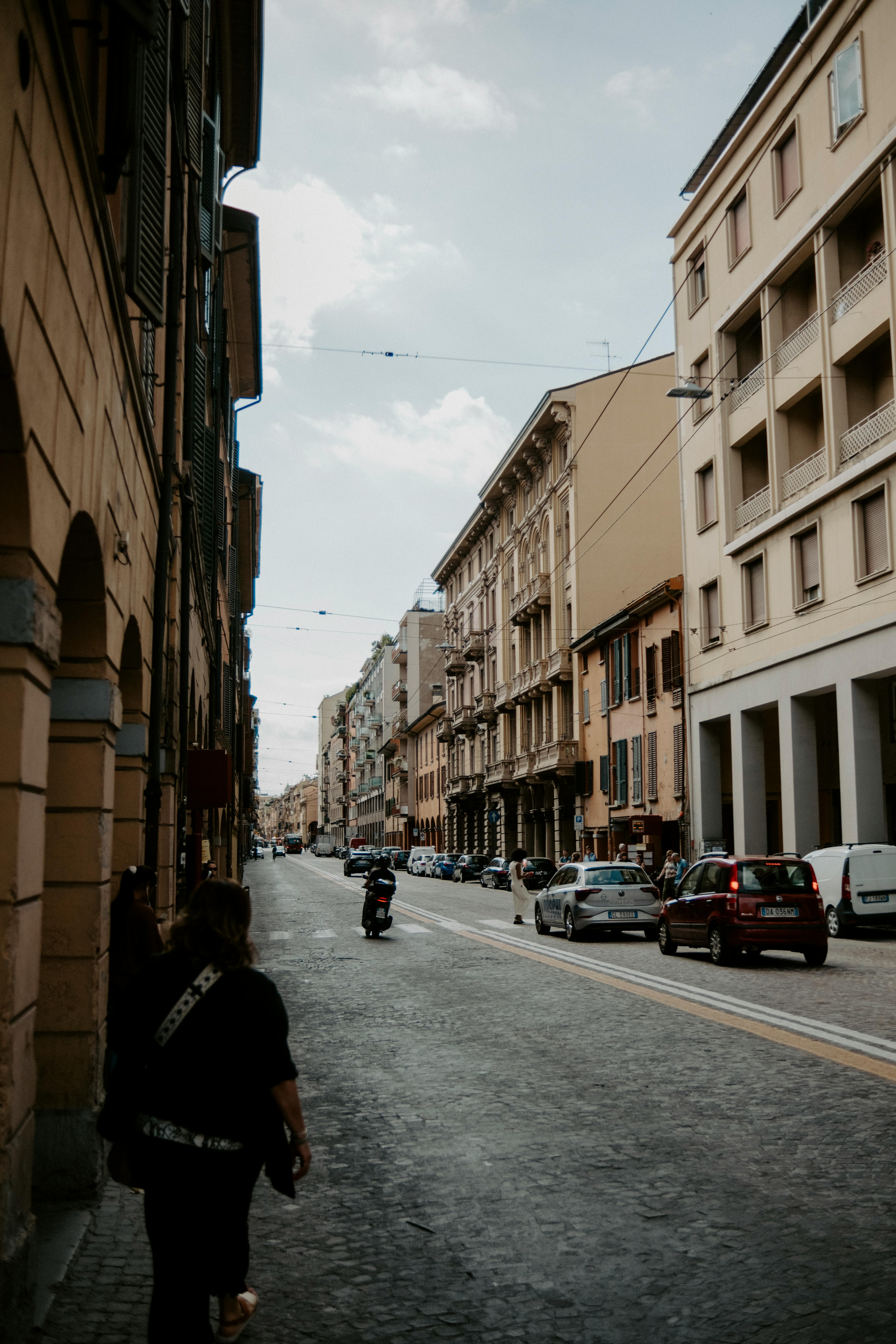 Explore the charm of Bologna's historic streets with classic architecture and urban life.