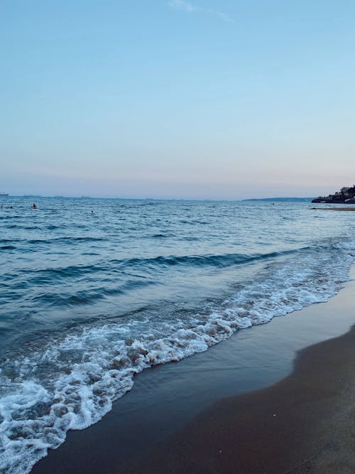 Waves Washing up the Beach in the Evening 