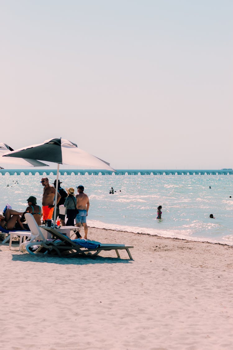 Tourists By The Sea