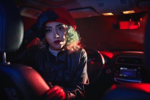 Blonde Woman in Beret in Car