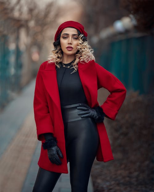 Blonde Woman Standing in Red Coat
