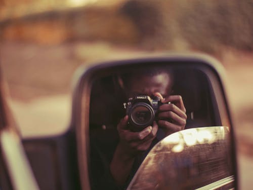 Camera in Car Mirror Reflection
