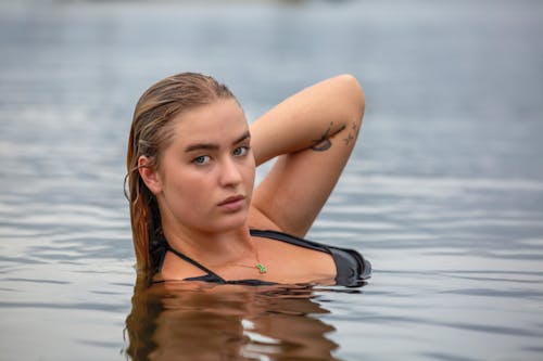 Young Woman Swimming in the Water 