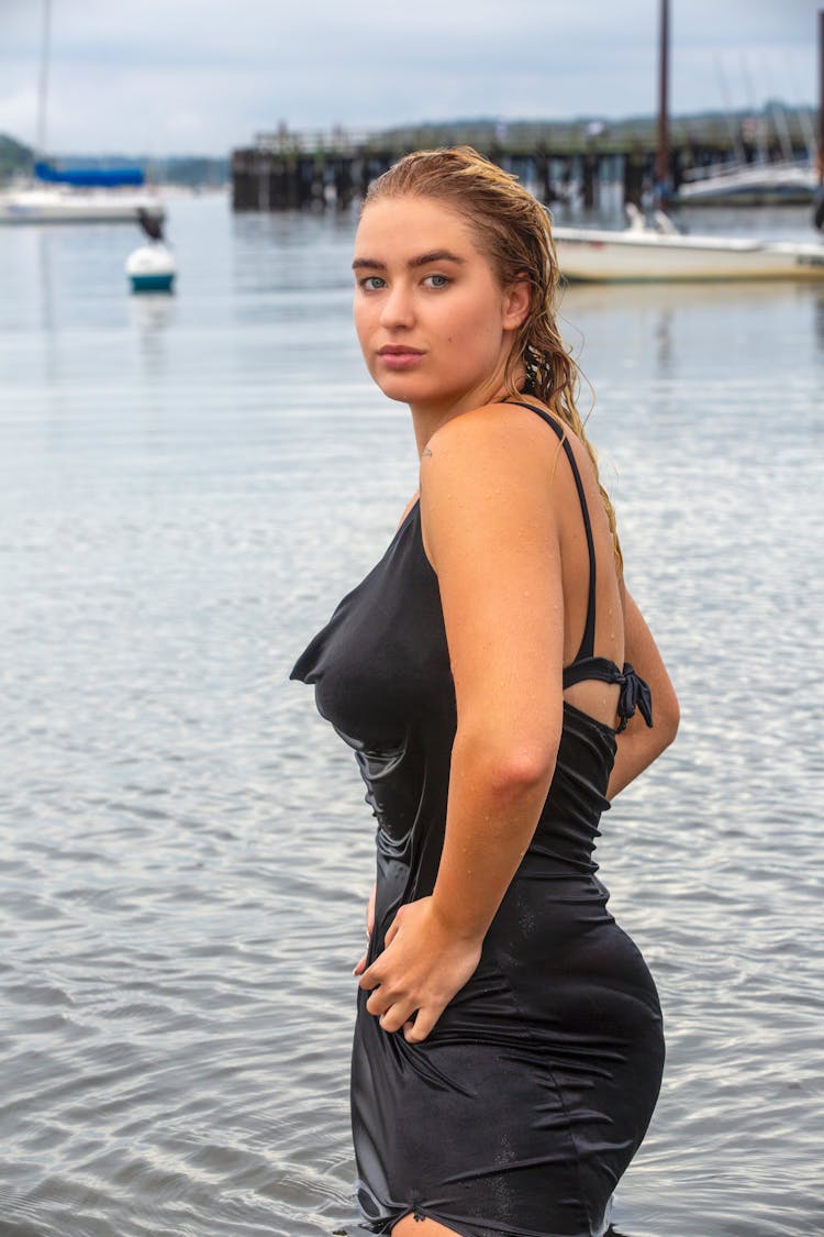 Woman Standing In Wet Strap Dress