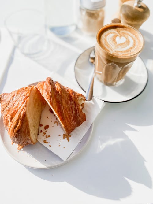 Free Croissant and Cup of Cappuccino Stock Photo