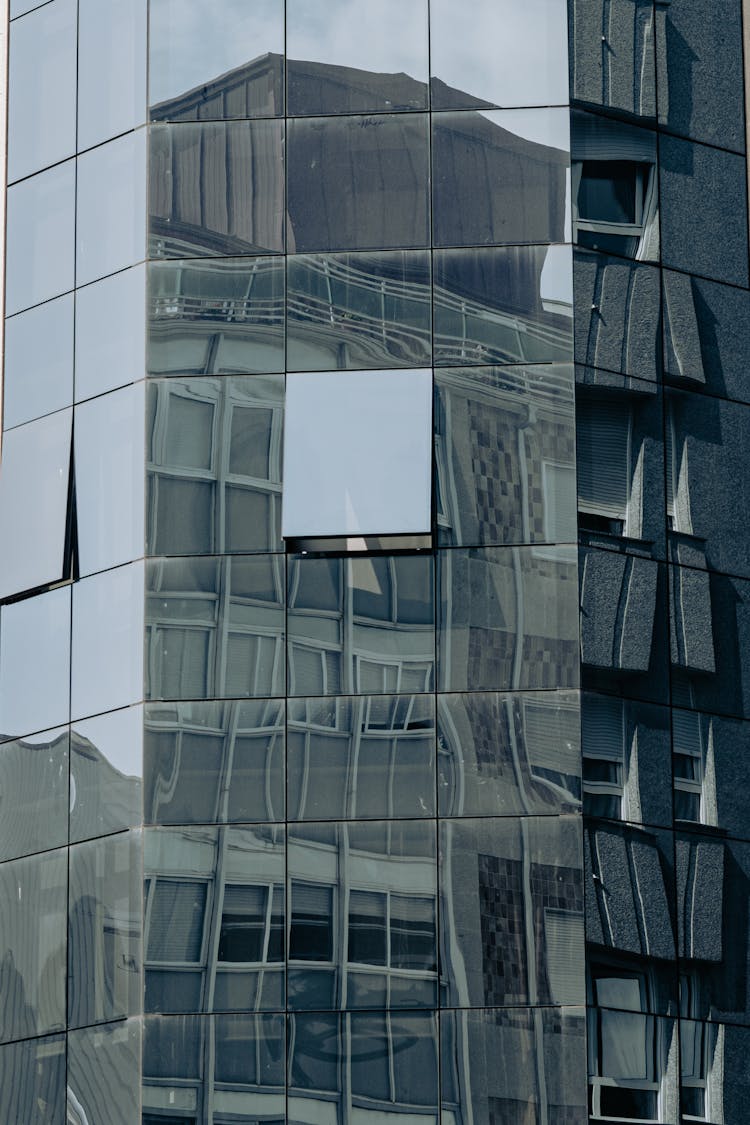 Building Reflecting In Facade