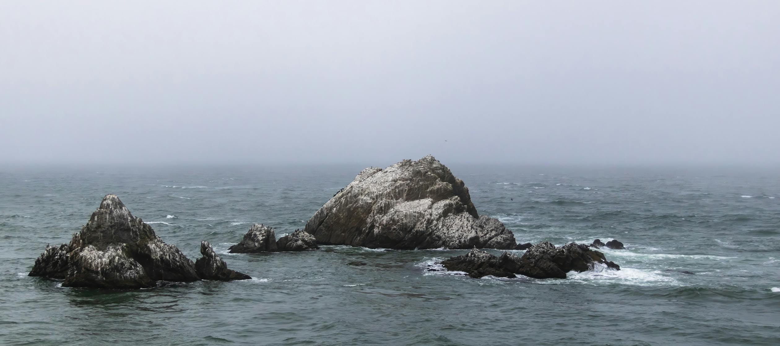 Spiky Rock in Sea · Free Stock Photo