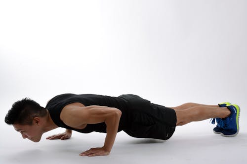 Free Man Push-up on White Floor Stock Photo