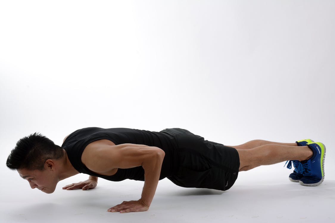 Man Push-up on White Floor