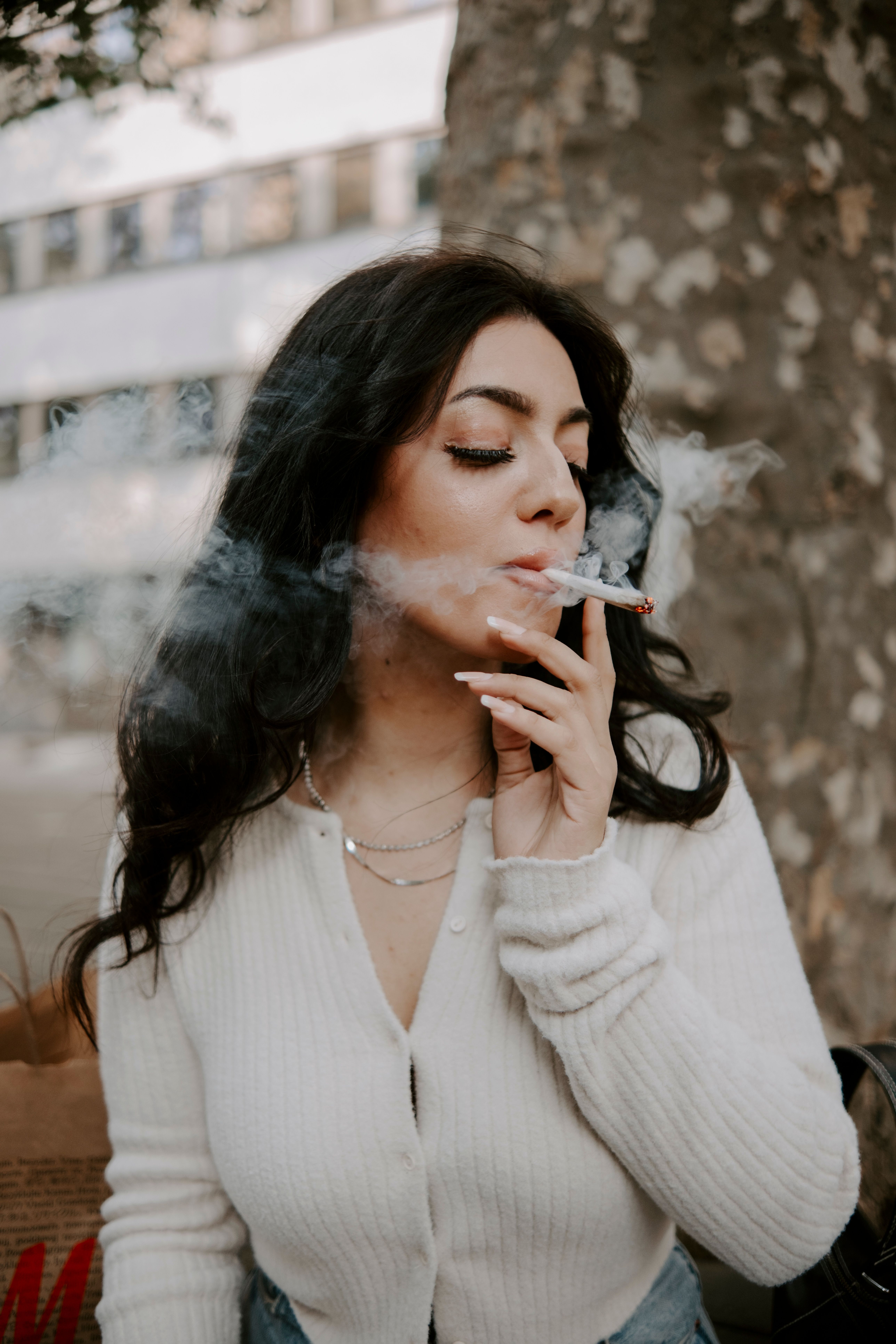 Woman Smoking a Cigarette · Free Stock Photo
