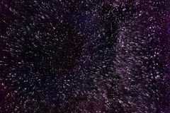 An abstract depiction of a starry night sky with dark violet hues and texture, ideal for backgrounds.
