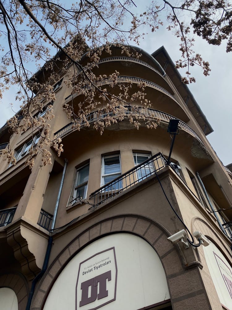 Semicircular Balconies On The Corner Of An Apartment Building