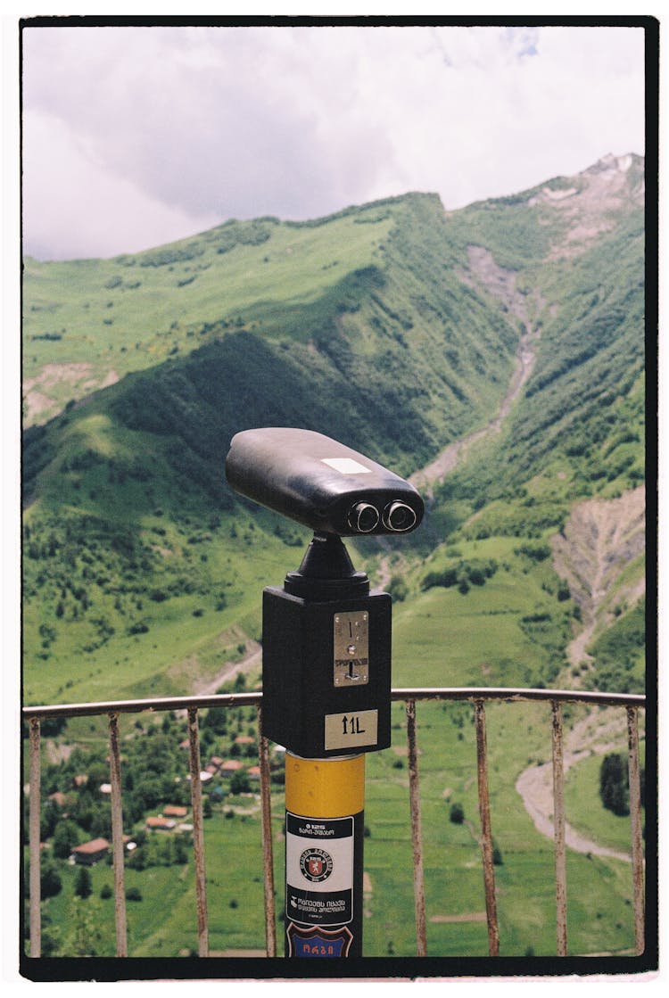 Framed Picture Of Binoculars On Terrace In Mountains Landscape