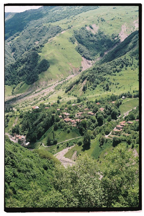 Houses on Hills in Summer Mountains Landscape