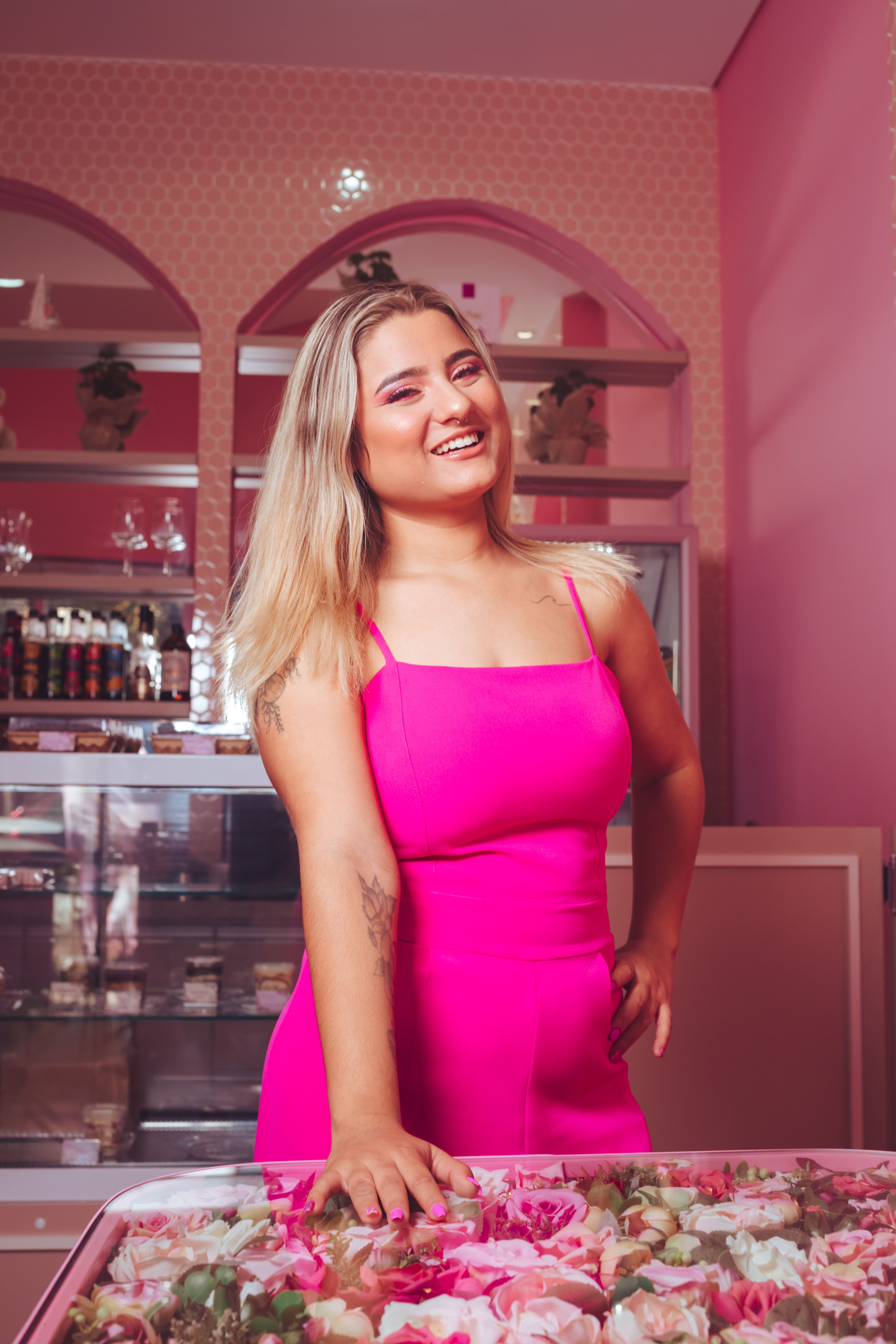 Blonde Wearing Pink Clothing Smiling in a Pink Bar Interior  Free Stock  Photo