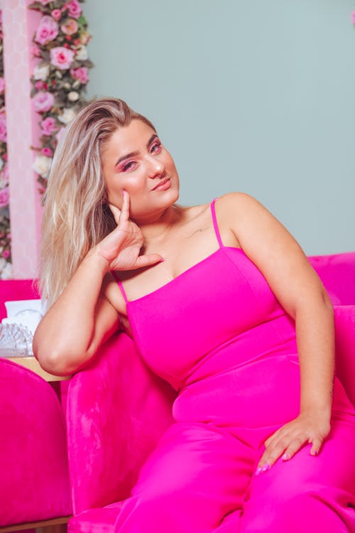 Woman Wearing Pink Clothes Sitting on a Pink Armchair