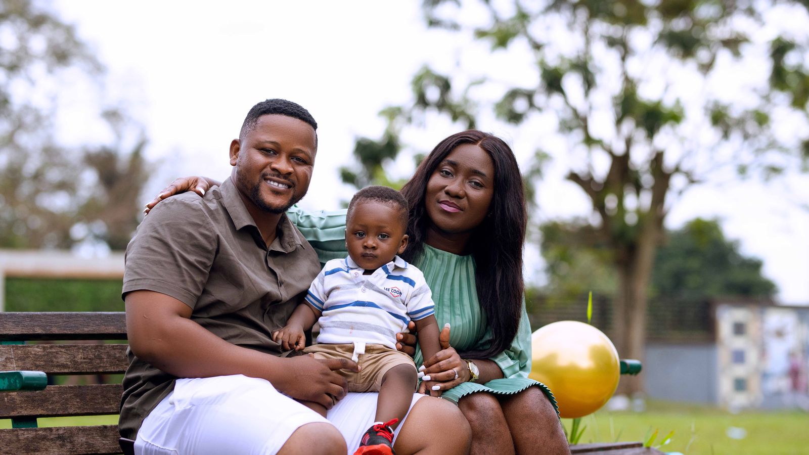 Happy family on bench, Ghana