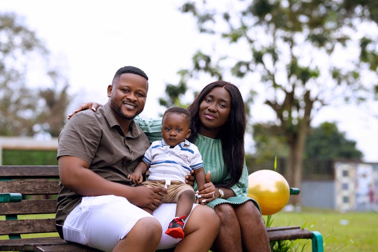 Happy Family On Bench