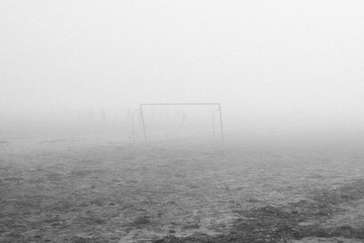 Misty soccer field in El Jadida, Morocco, with an atmospheric and serene feel.