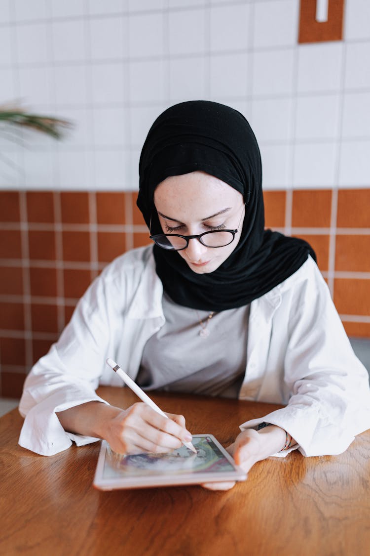 Young Woman Drawing On A Tablet 