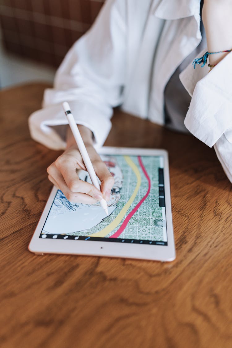 Close-up Of Woman Drawing On A Tablet 