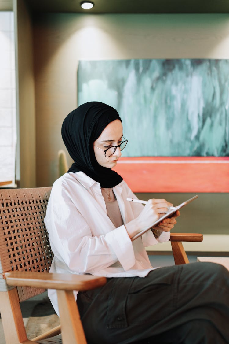 Young Woman Drawing On A Tablet 