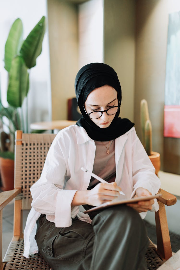 Young Woman Drawing On A Tablet 