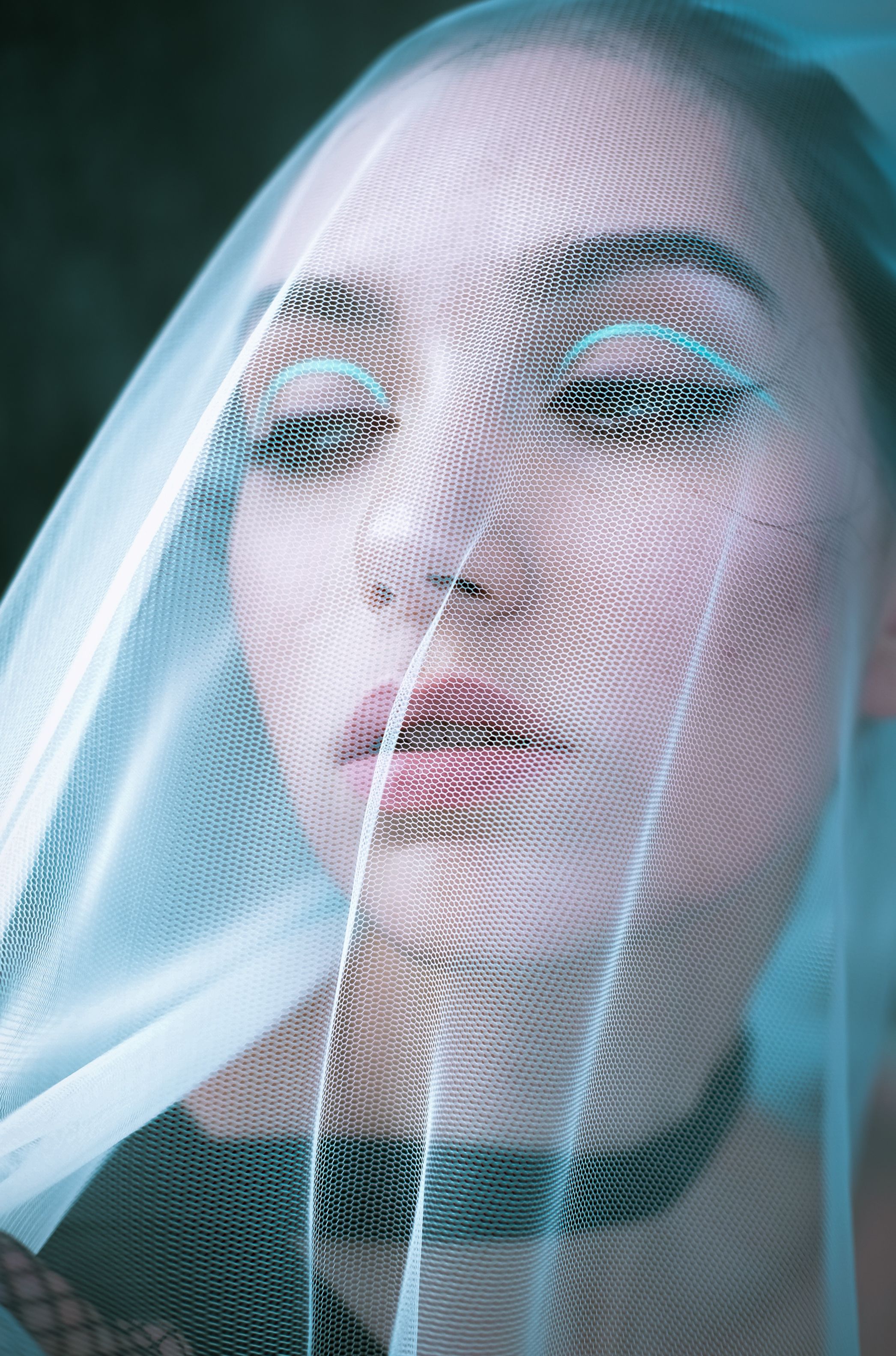 Portrait of a Young Woman Wearing a Veil over Her Face · Free Stock Photo