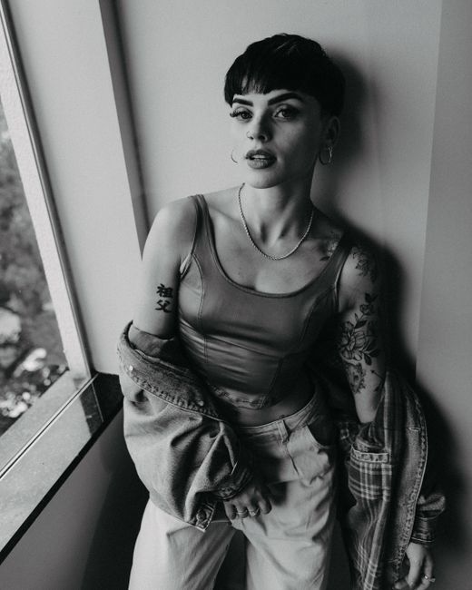 Portrait of a young woman with tattoos in a modern and trendy look, Maringá, Brazil.