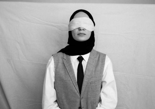 Black and White Picture of a Blindfolded Woman 