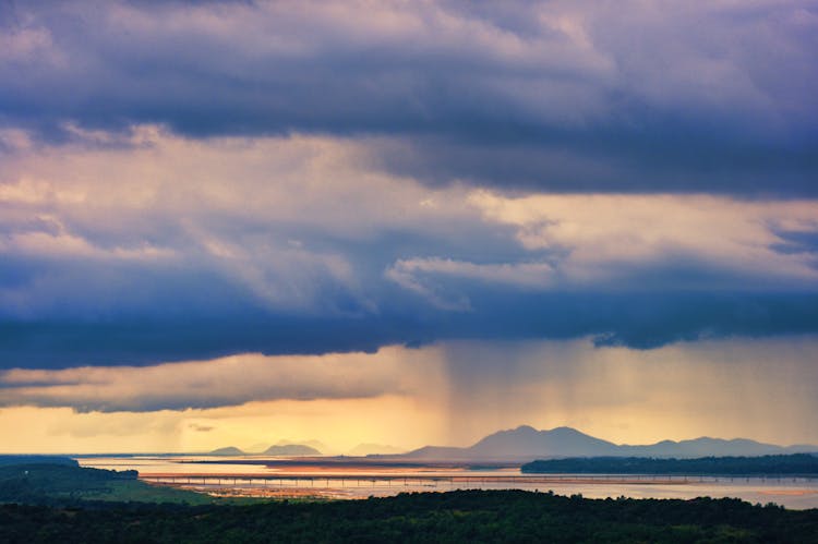 Rain Clouds On Sky At Sunset