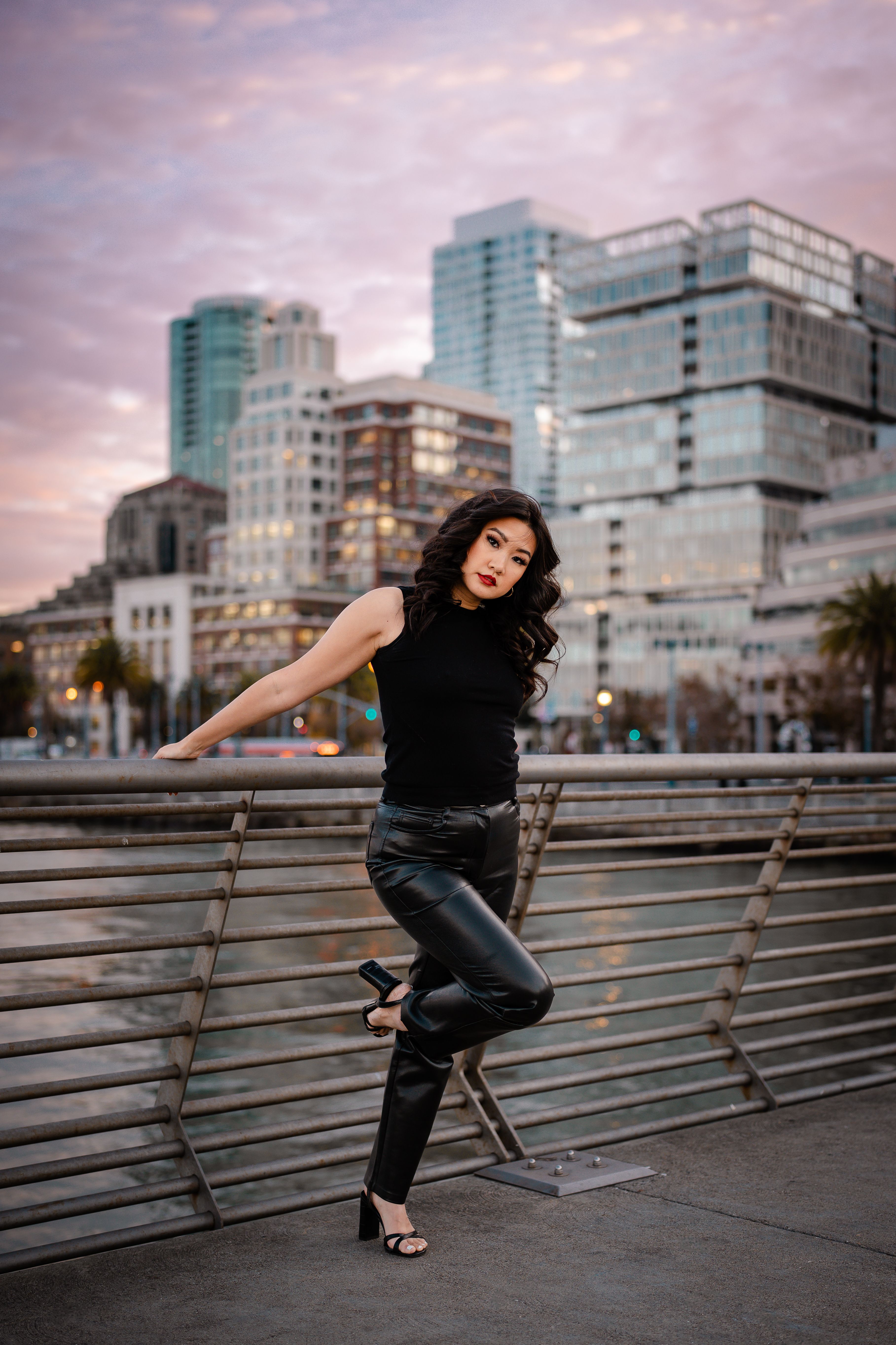 Brunette Woman Posing on Bridge in City · Free Stock Photo