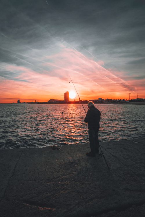Angler Fish Spoting Angler Fishing at Sunset · Free Stock Photo