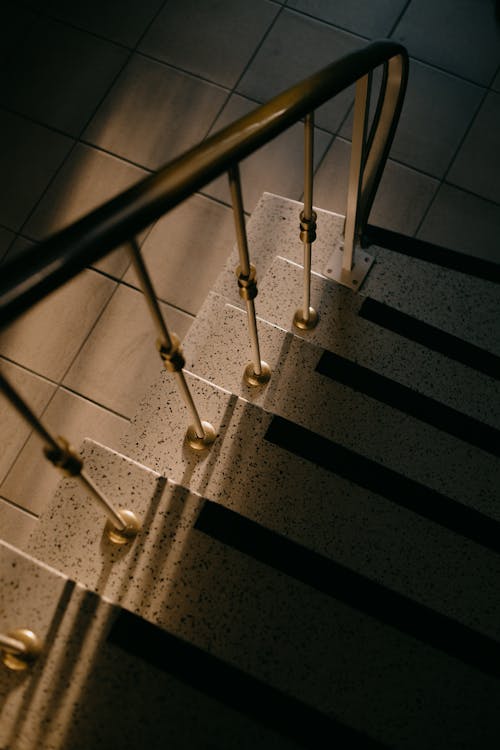View of a Stairs with a Golden Handrail 