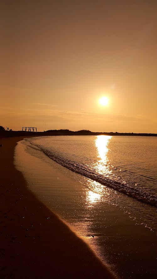 Sun over Sea Shore at Sunset