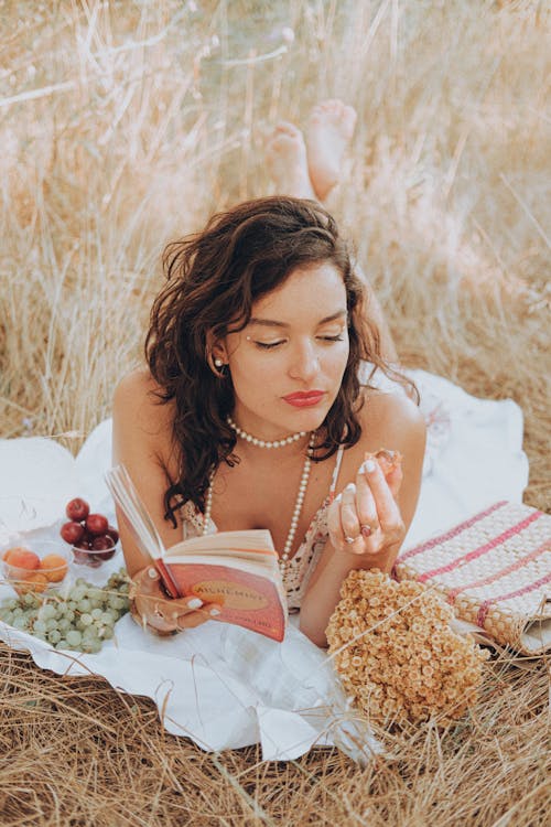 Free A Woman Lying in a Field Stock Photo