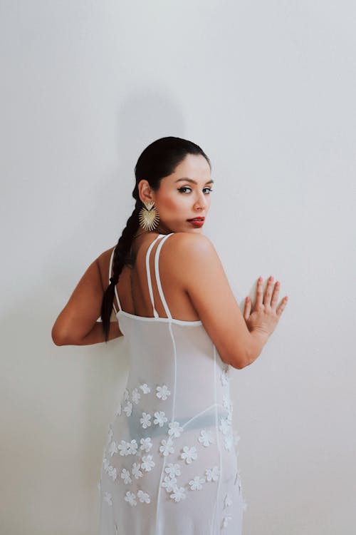 Brunette Woman in Thin White Dress