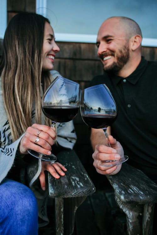 Couple Clinking with Wineglasses