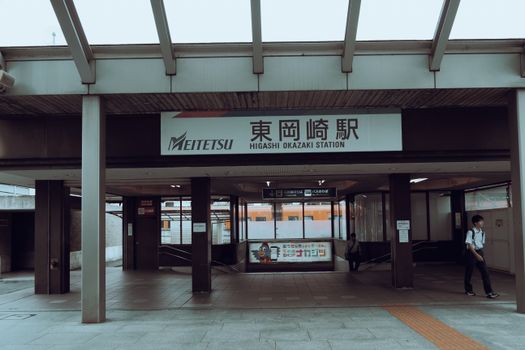 View of Higashi Okazaki Station entrance with visible signage in Japan.