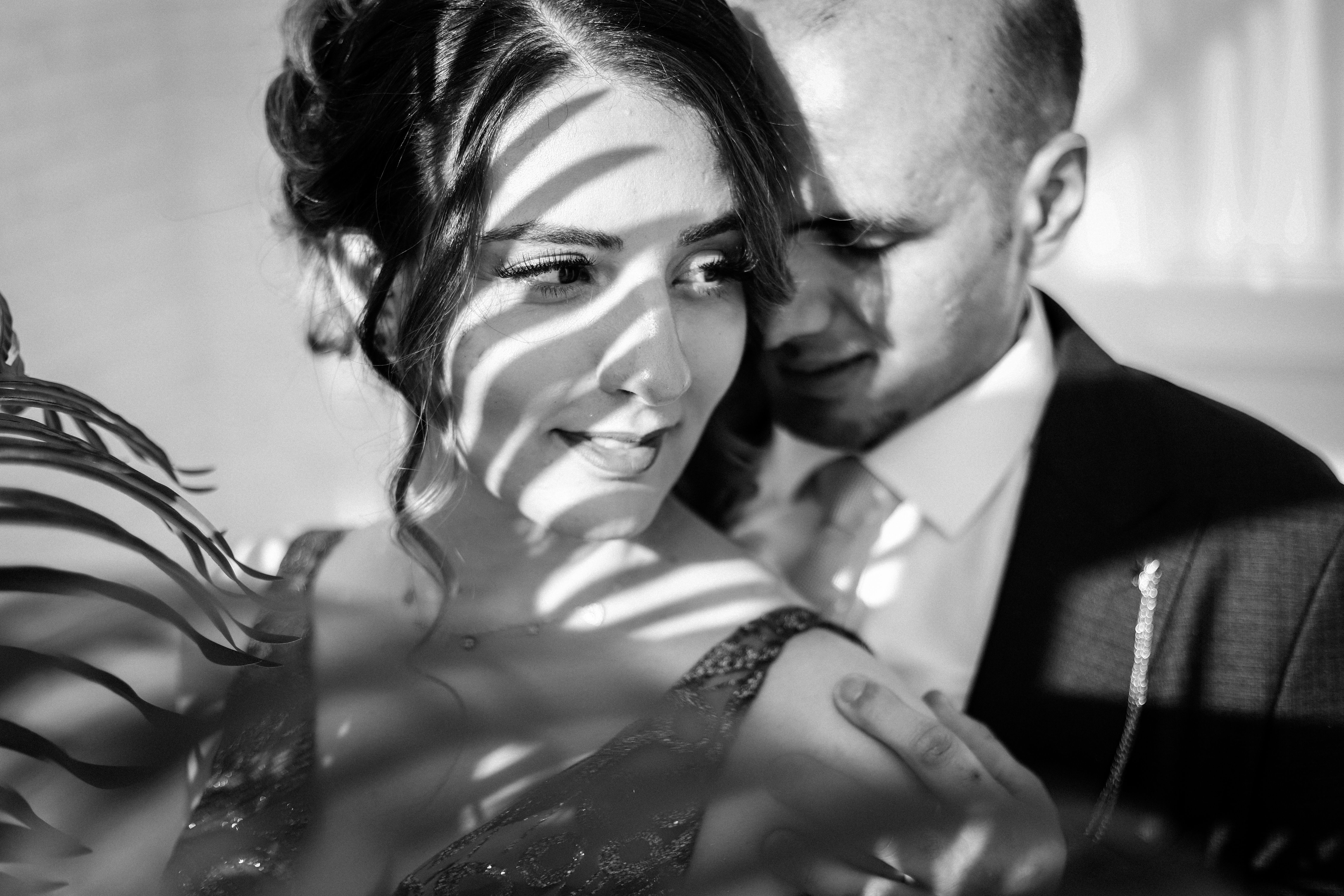 Man Embracing Woman in Black and White · Free Stock Photo