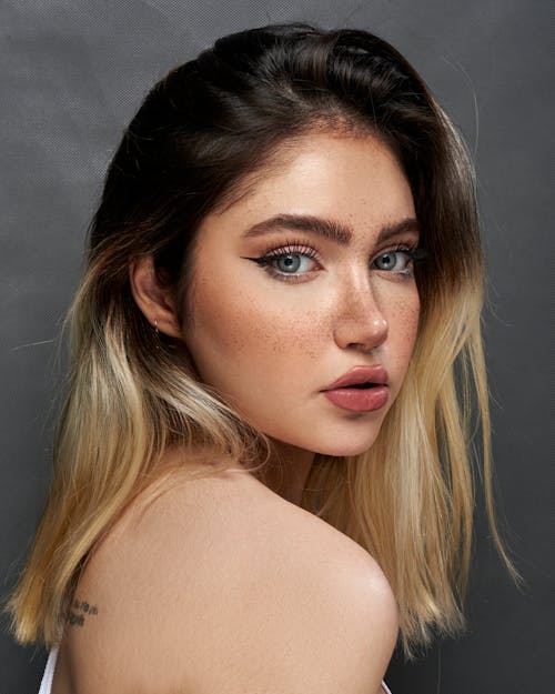 Studio Portrait of a Young Woman with Blue Eyes 