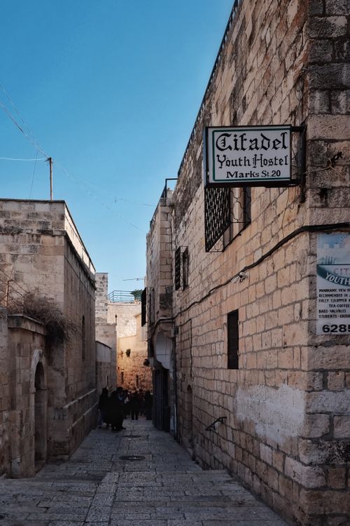 Free A narrow cobblestone street with historic architecture in Old Jerusalem, Israel. Stock Photo