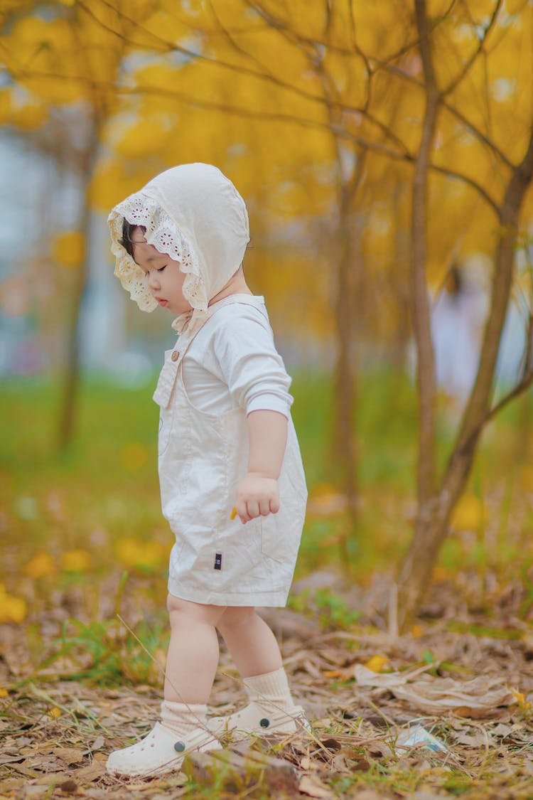 Girl In Park In Autumn