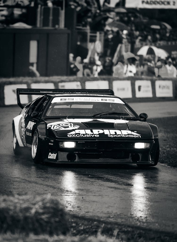 Racing Car On Circuit In Rain