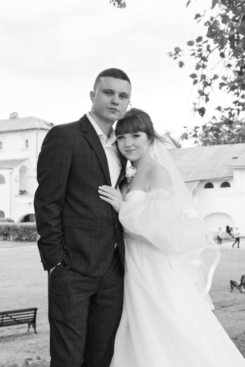 Newlyweds Standing Together in Black and White