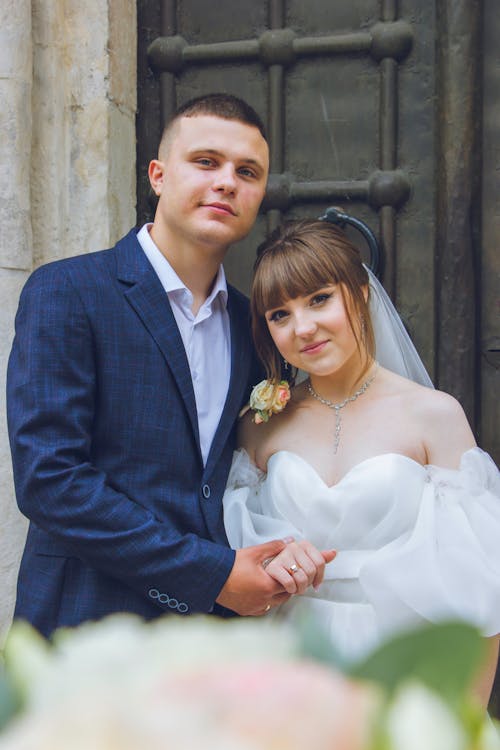 Bride and Groom Standing Close and Smiling 