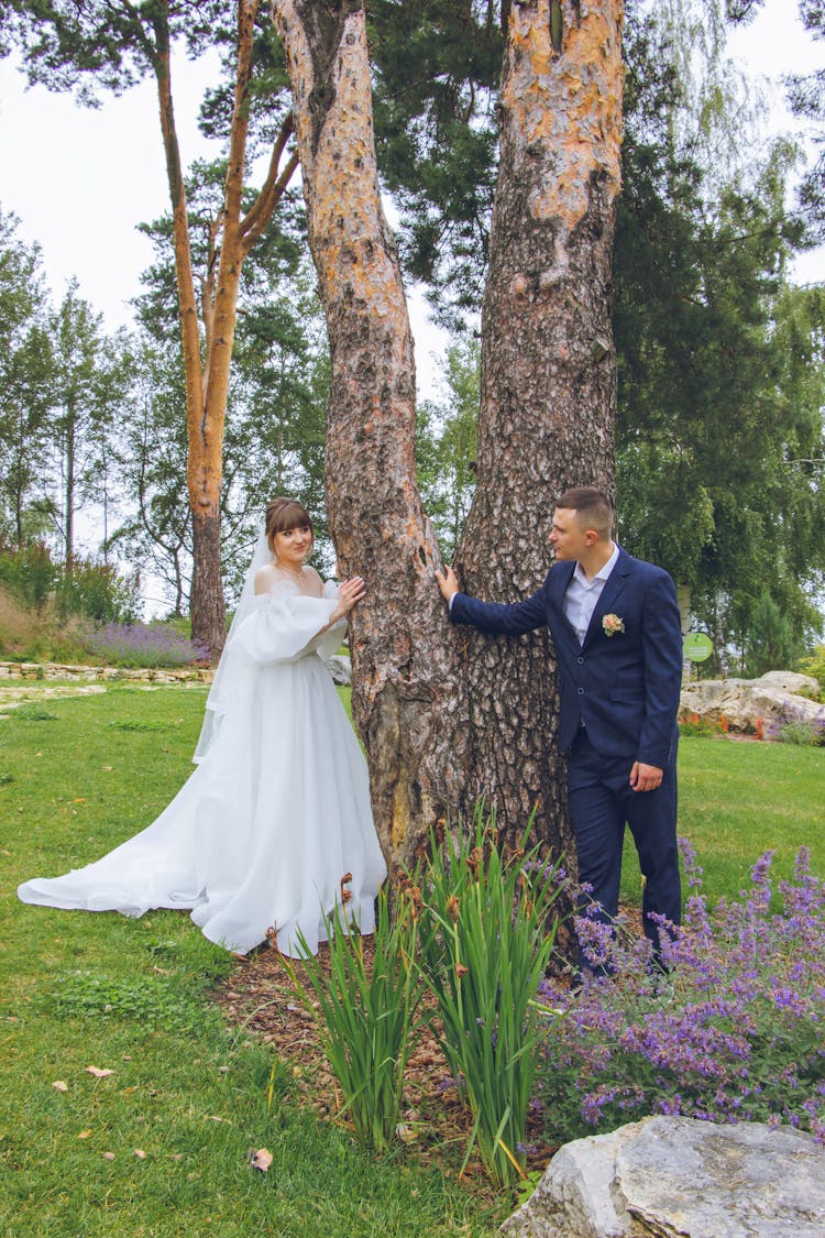 Bride And Groom Posing Outside 