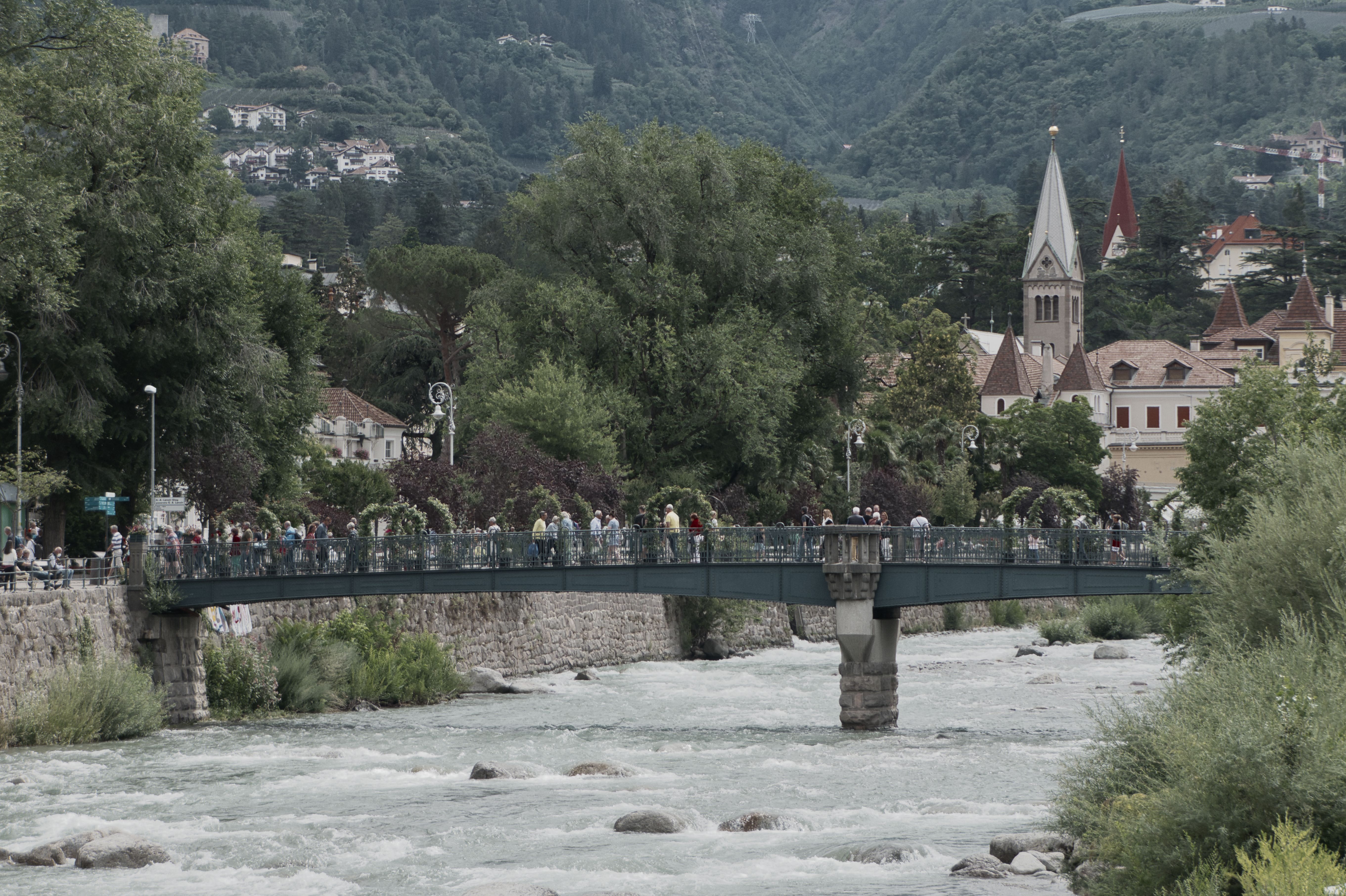People Walking on a Bridge over Passer River, Merano, Italy · Free ...