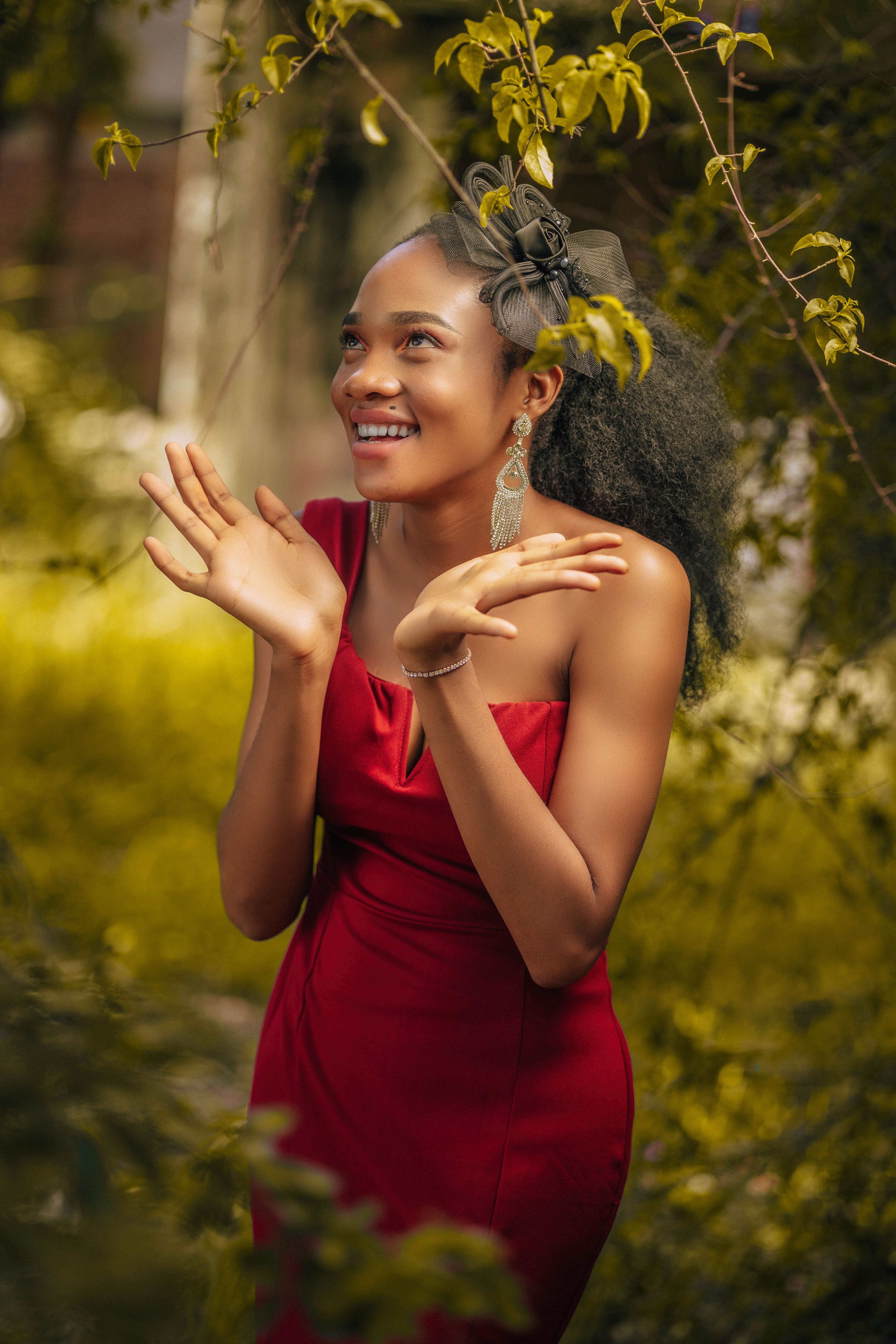 lady in beautiful dress Summer portrait of young beautiful lady wearing long white evening dress posing in the park. Graduate Girl Stock Photo