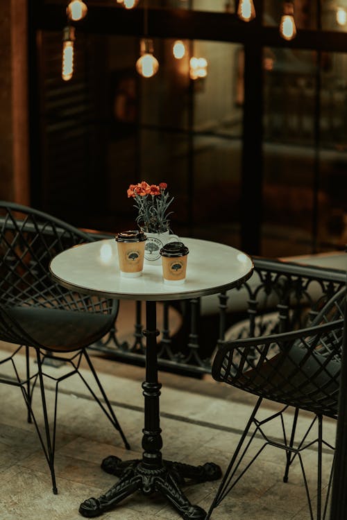 Free Two Coffee Cups on a Coffee Table Stock Photo